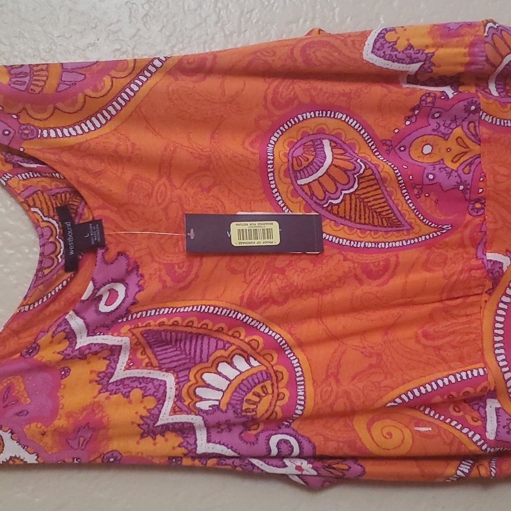Large long sleeveless dress made by westbound. Bright orange and purple.